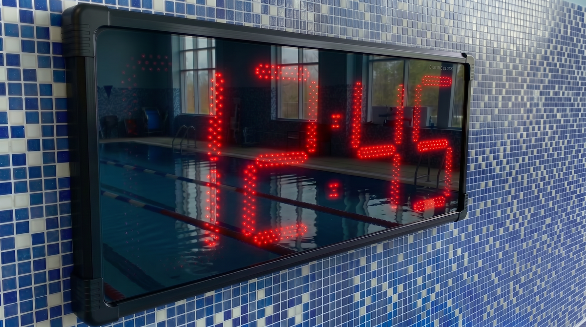 BigTimeClock digital waterproof clock displaying time on a blue tiled pool wall